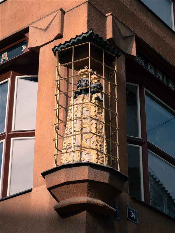 Baroque statue on the façade of the House at the Black Madonna