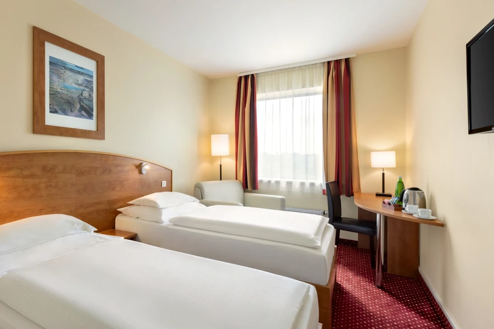 postele pokoje hotelu Amedia Express Prague